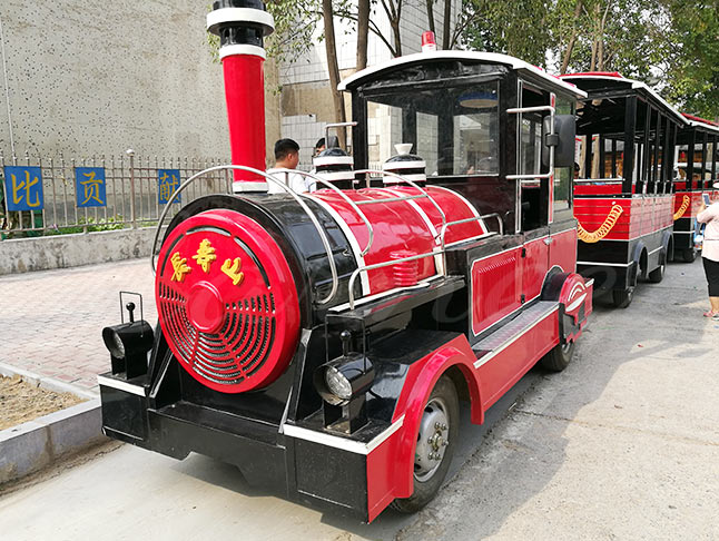 Bright Red Train Themed Amusement Park Ride