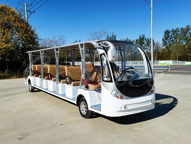 Open-side 23 passenger electric shuttle bus with white body and beige seats