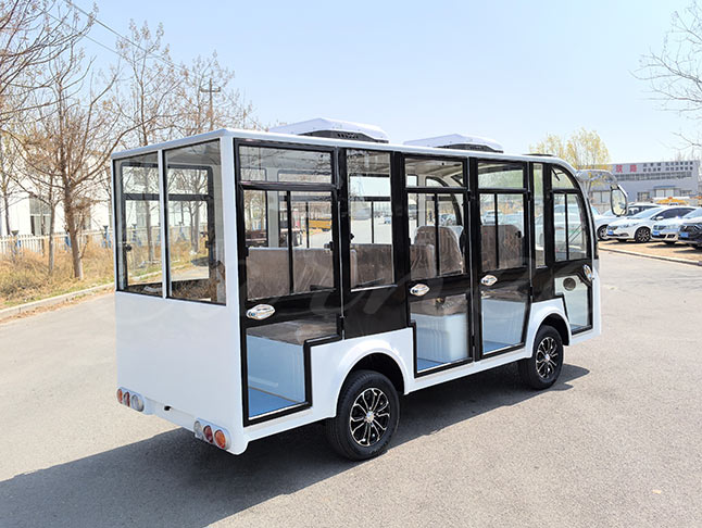 Rear view of the white 11-seater closed electric sightseeing bus highlighting its efficient design and spacious interior