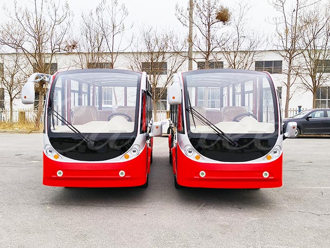 Front view of two 11-seater electric sightseeing buses, designed for comfort and low-noise operation in tourist locations