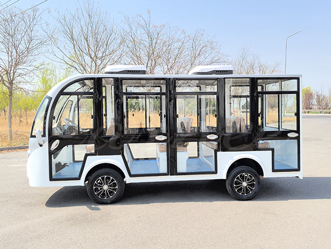 Side view of the white 11-seater electric sightseeing bus with ample seating and eco-friendly electric drive system