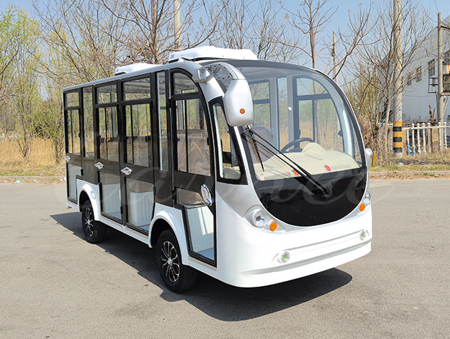White 11-seater closed electric sightseeing bus with a stylish design, ideal for eco-friendly travel in scenic spots