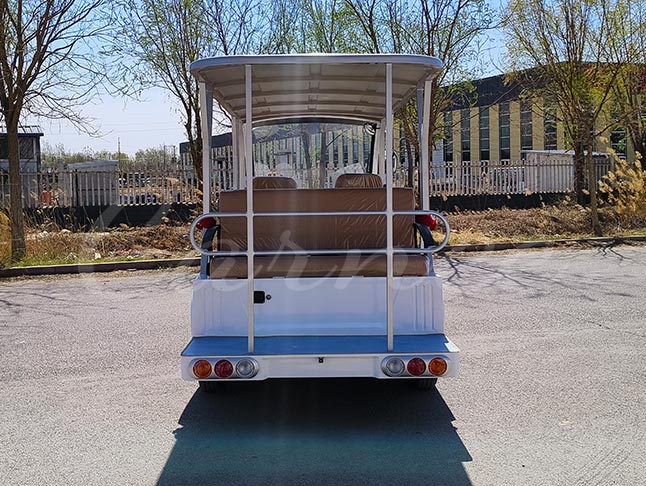 Rear view of the 11-seater open electric shuttle bus, showcasing its robust build and spacious design for tourists