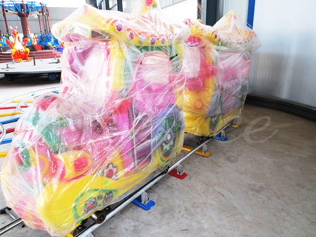 Colorful kids track train wrapped for shipping, showcasing vibrant design and sturdy packaging for transportation