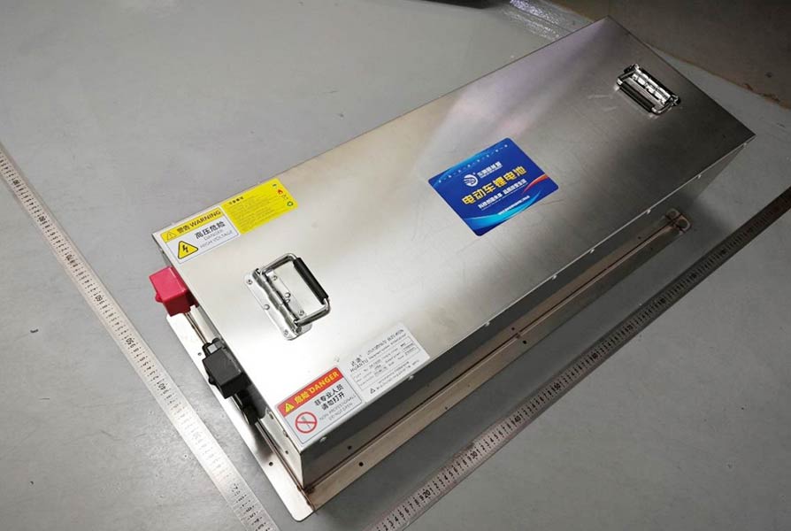 Detailed view of a lithium battery pack used in electric golf carts.