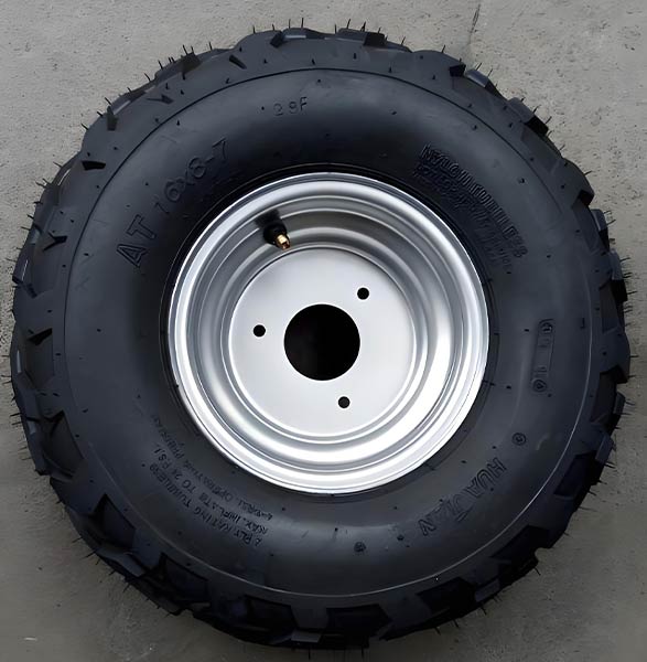 Durable off-road tire and rim for electric golf cart maintenance and upgrades.