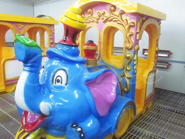 Colorful kids elephant train ride with playful decorations for amusement parks and kids’ play areas.