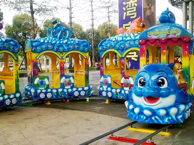 Ocean train ride with track designed for children, featuring sea creature designs and bright colors