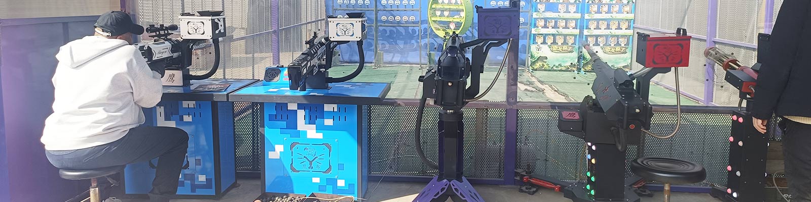 UAE customer experiencing interactive military shooting range at Carnee Rides factory during on-site visit.