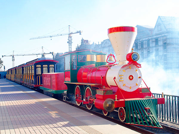 Colorful kids’ electric amusement park train ride with LED lights for safe night operation.