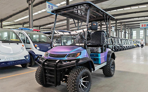 Utility golf cart with sturdy build on display in warehouse, showing typical width of utility golf buggies.